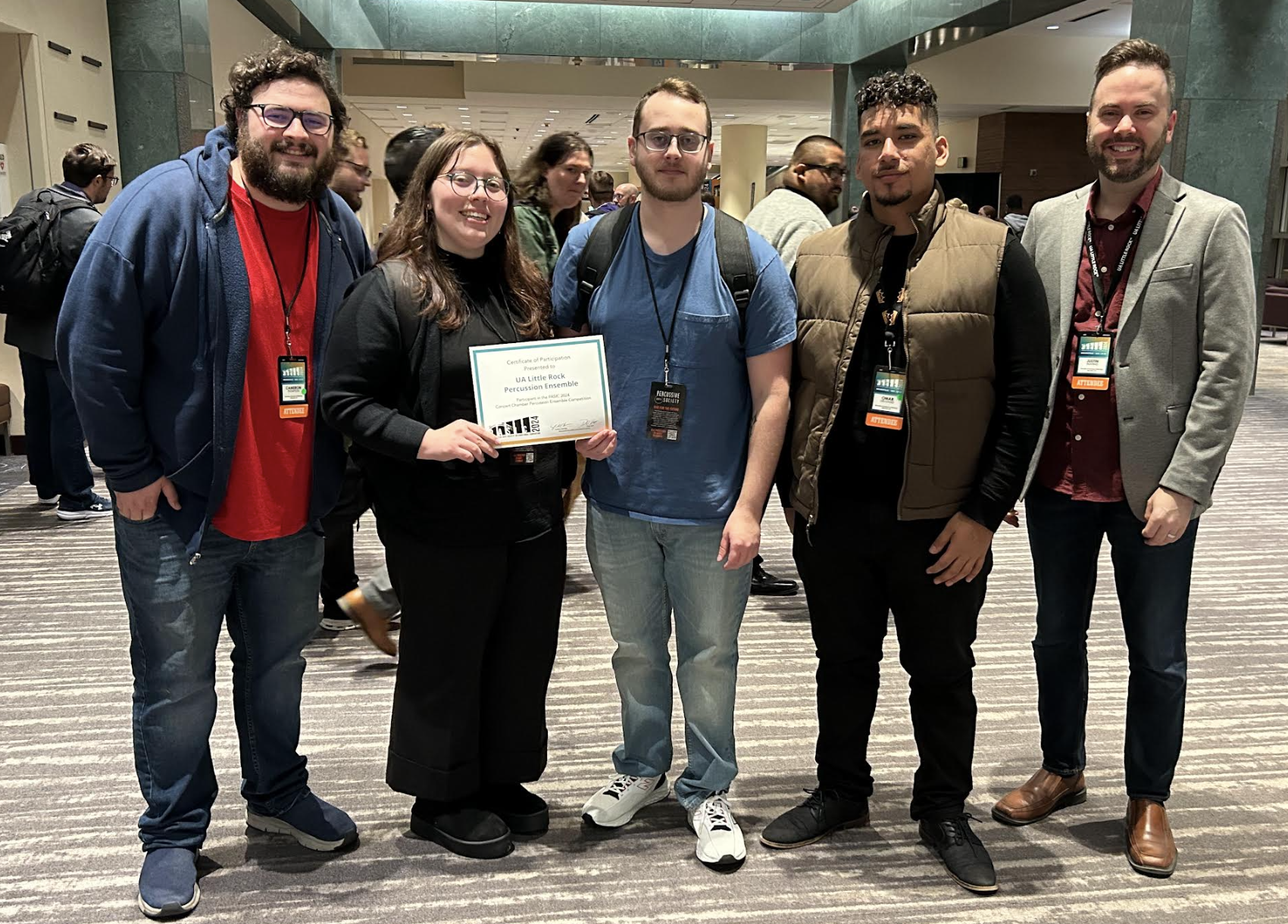 Dr. Justin Bunting, right, and UA Little Rock students attend the Percussive Arts Society International Convention.